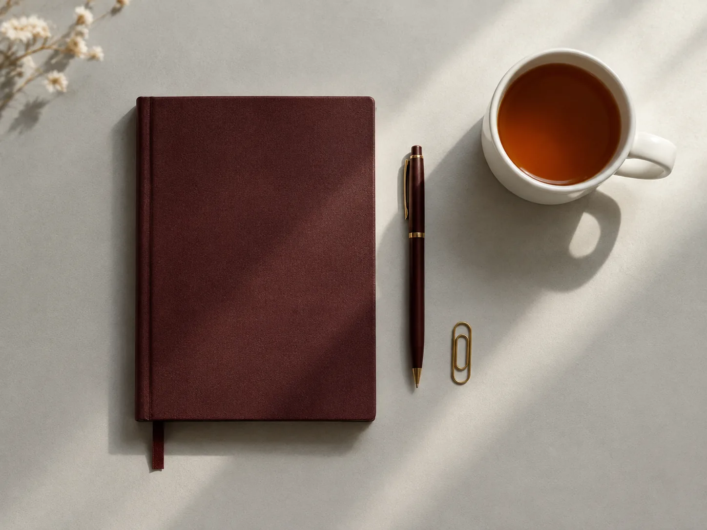 Home A notebook and pen on a desk where a brief is being written